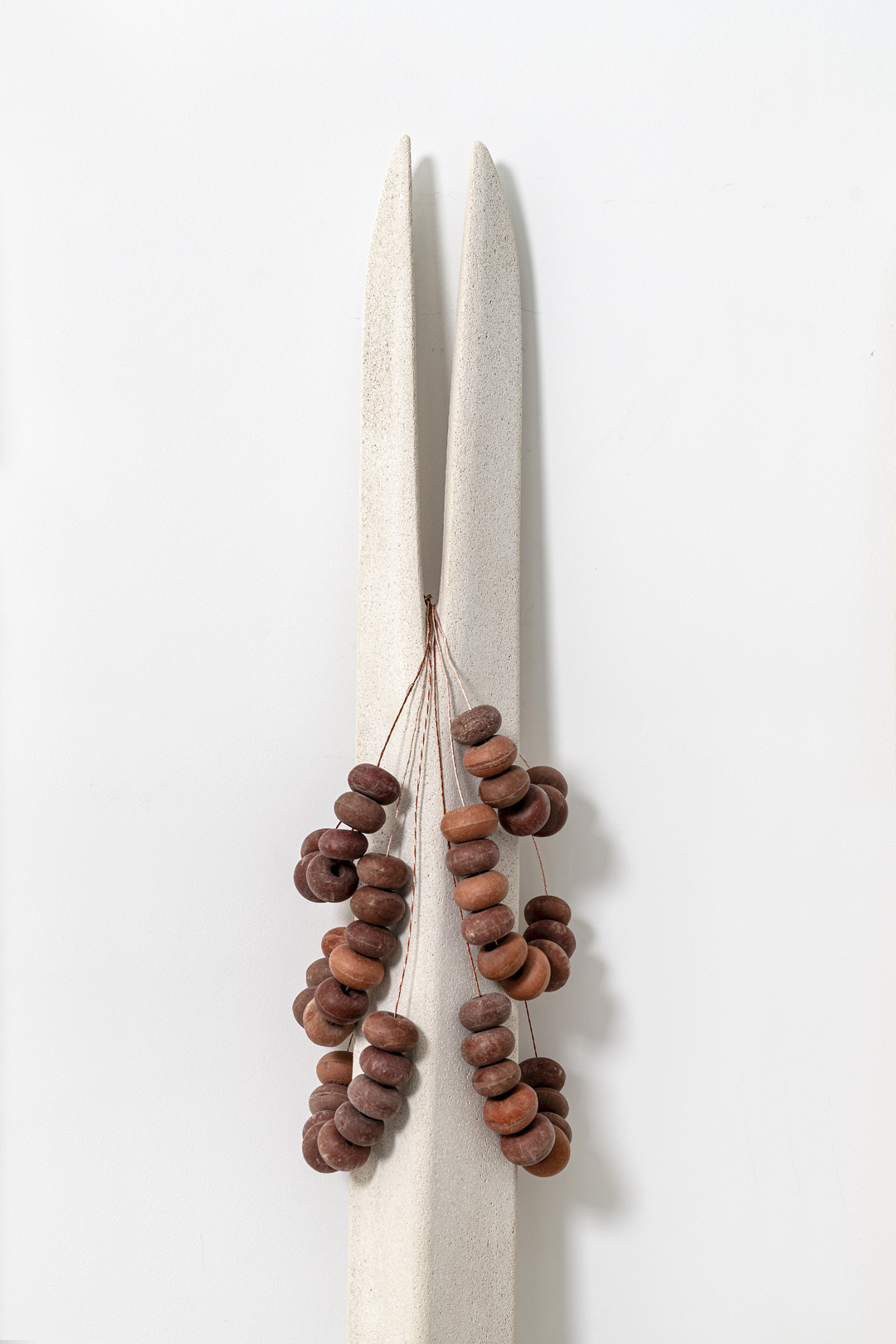 FIGURINE Ι, 2024 | calcarenite stone Pachna formation / metal / 210 x 12 x 24 cm